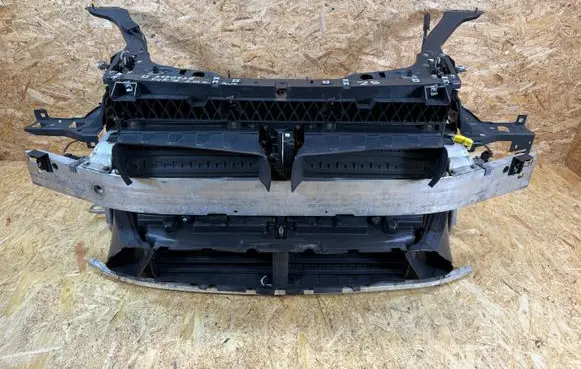 Radiator support slam panel