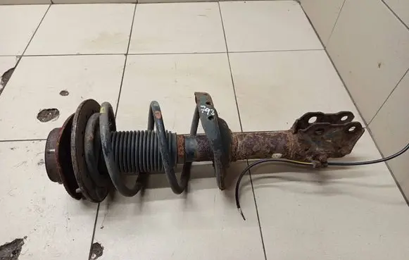 Subaru Impreza II Front shock absorber with coil spring 