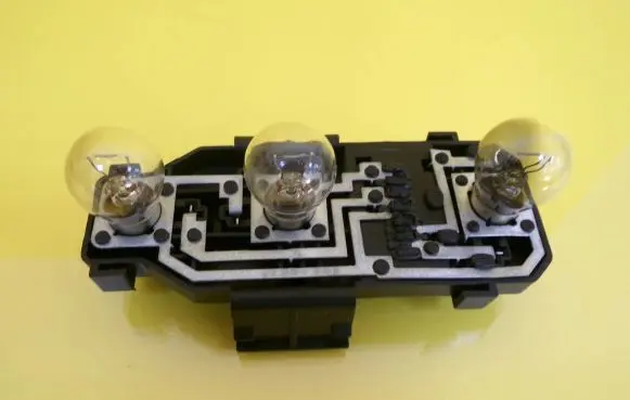 Tail light bulb cover holder