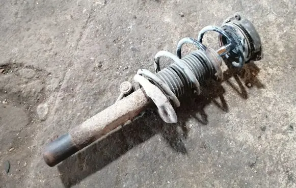 Volkswagen Golf V Front shock absorber with coil spring 1K0413031BH