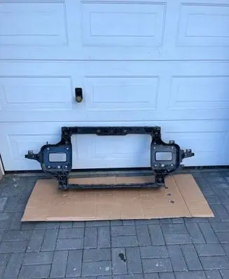 Radiator support slam panel