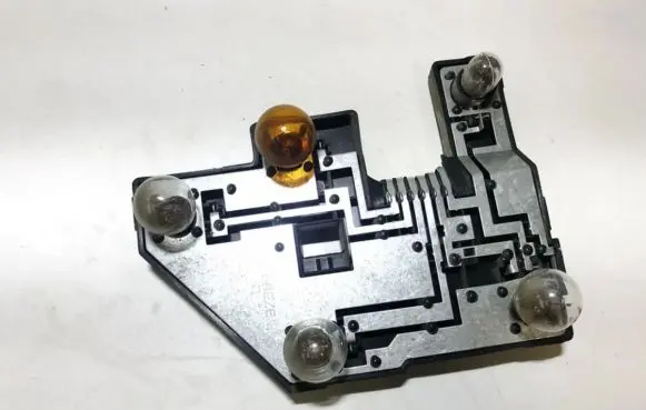 Tail light bulb cover holder