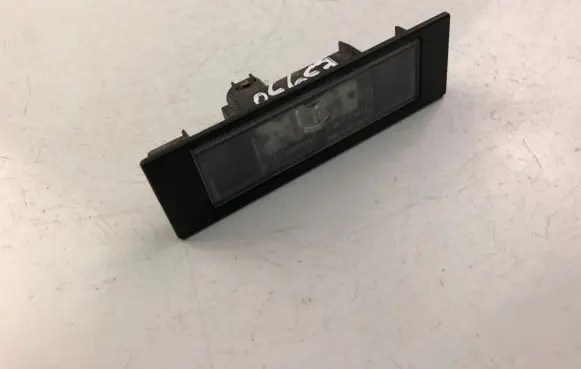 BMW 1 E81 E87 Trunk door license plate light bar 7193294