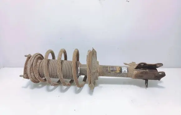 Nissan Almera N16 Front shock absorber with coil spring