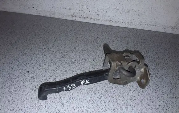 Front door check strap stopper