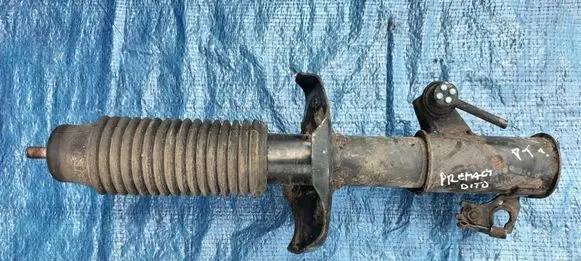 Mazda Premacy Front shock absorber with coil spring 4646493
