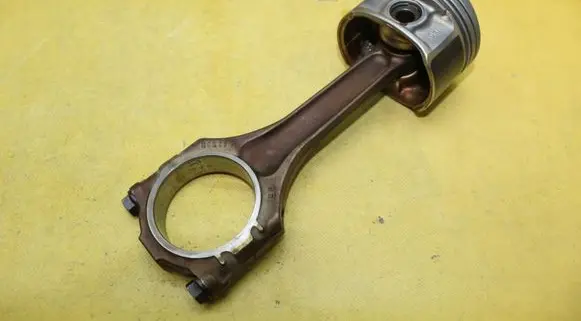 Piston with connecting rod