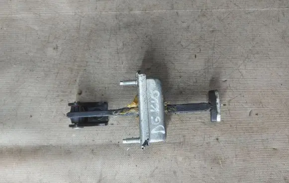 Front door check strap stopper