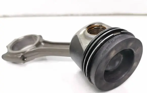 Piston with connecting rod