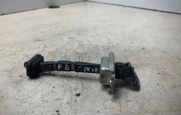 Front door check strap stopper