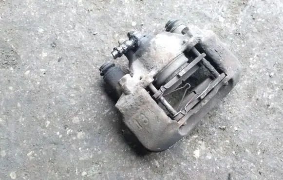 Mazda 323 F Front brake caliper