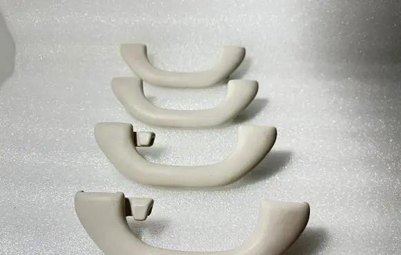 Volkswagen PASSAT B7 A set of handles for the ceiling 1K0857607N 1K0857607M