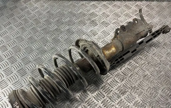Opel Astra J Front shock absorber with coil spring 13354031