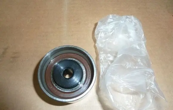 Mazda 626 Belt tensioner pulley J1143026