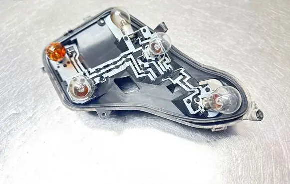 Opel Astra H Tail light bulb cover holder VP7HLX13N004