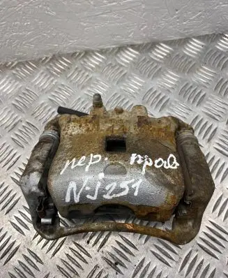 Nissan Juke I F15 Front brake caliper