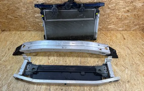 Radiator support slam panel