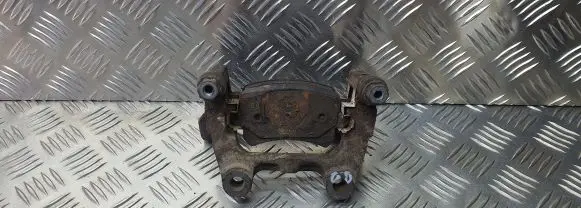 Volkswagen PASSAT B6 Brake caliper pad carrier rear 
