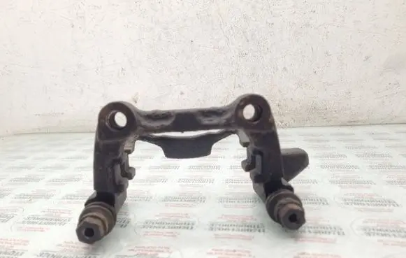 Volkswagen Touran I Brake caliper pad carrier rear 