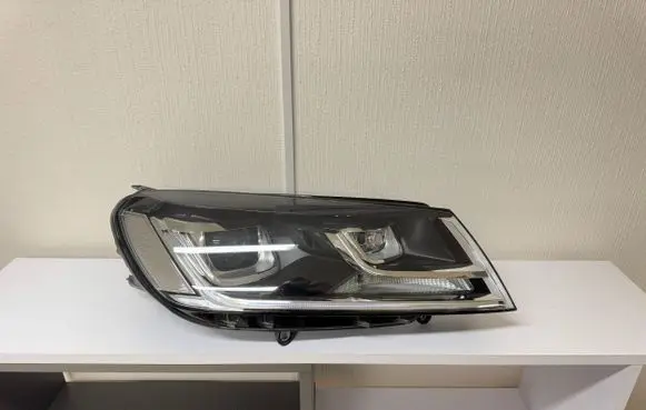 Volkswagen Touareg II Headlight/headlamp 7P1941034A