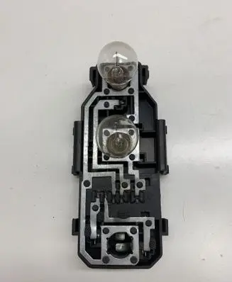 Tail light bulb cover holder