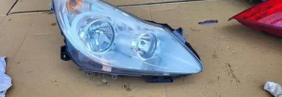 Opel Corsa D Headlight/headlamp 13186382 89313300