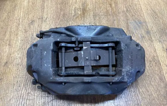 Volkswagen Touareg II Front brake caliper 7P6615106AJ