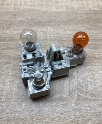 Tail light bulb cover holder