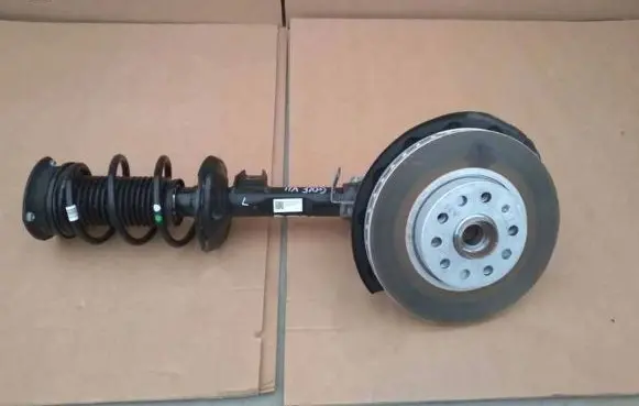 Volkswagen Golf VII Front shock absorber with coil spring 5Q0413023FK