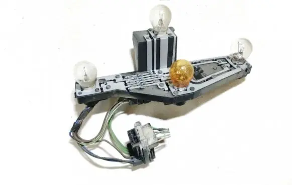 Tail light bulb cover holder