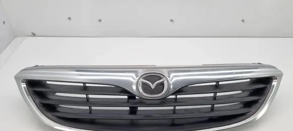 Mazda 626 Front bumper upper radiator grill GD7A50719