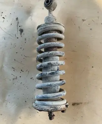 Nissan Pathfinder R51 Front shock absorber with coil spring