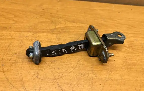 Subaru Impreza II Front door check strap stopper