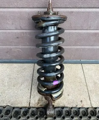 Nissan Pathfinder R51 Front shock absorber with coil spring