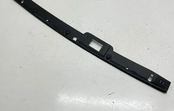 Engine bonnet/hood lock trim molding