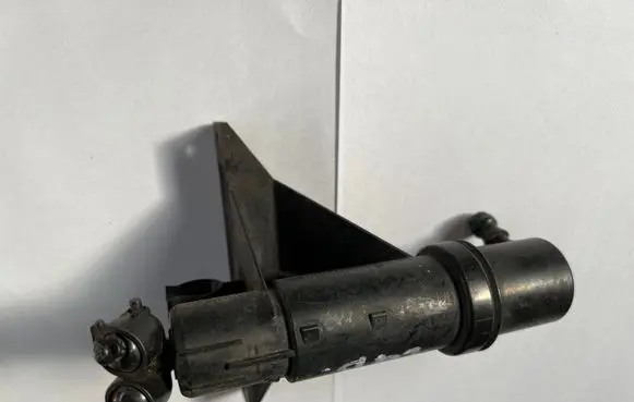 Volkswagen Touran I Headlight washer spray nozzle 1T0955978