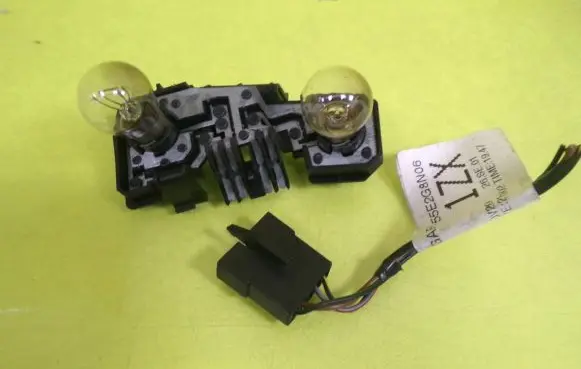 Tail light bulb cover holder