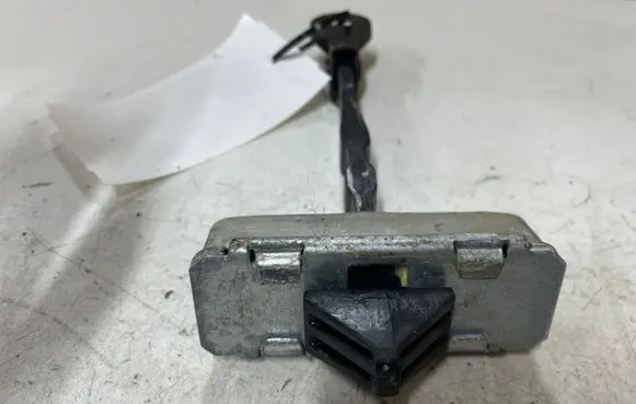 Front door check strap stopper
