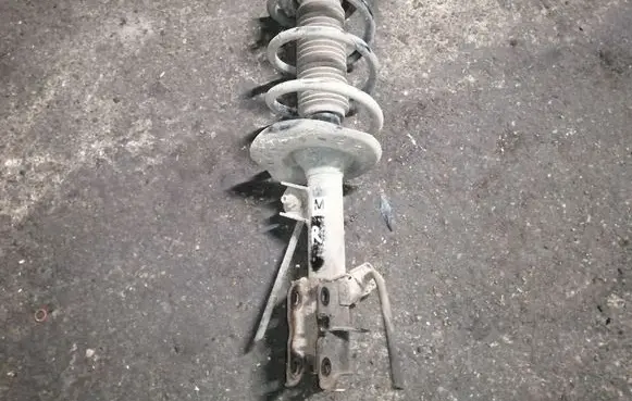 Nissan X-Trail T31 Front shock absorber with coil spring