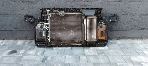 Radiator support slam panel