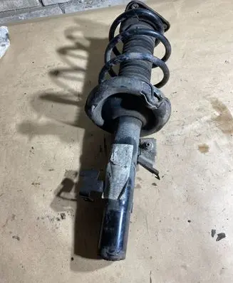 Front shock absorber with coil spring