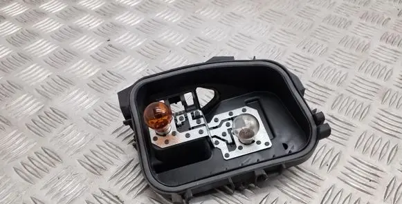 Tail light bulb cover holder