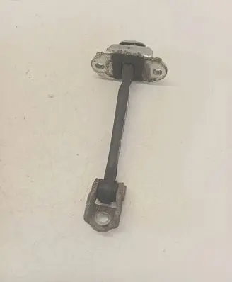 Front door check strap stopper