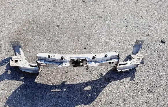 Radiator support slam panel
