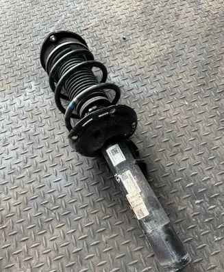 Volkswagen Golf VIII Front shock absorber with coil spring 5WA412038KB