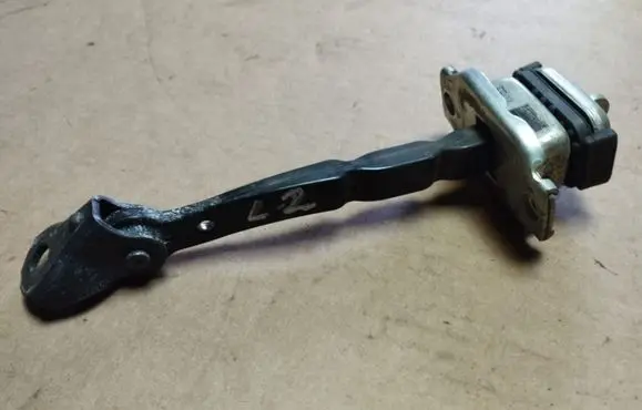 Rear door check strap stopper
