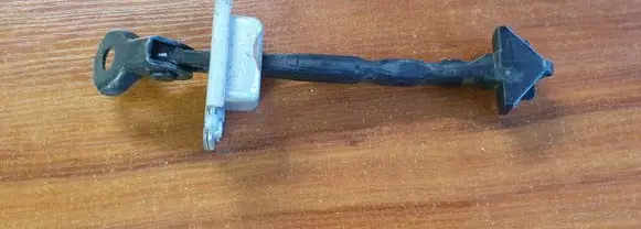 Mazda 2 Rear door check strap stopper