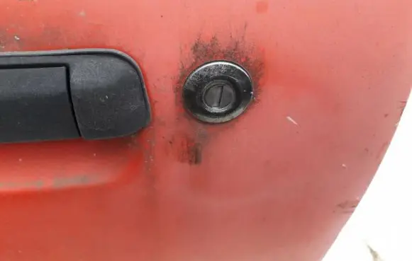Mazda 323 Front door lock (next to the handle) 