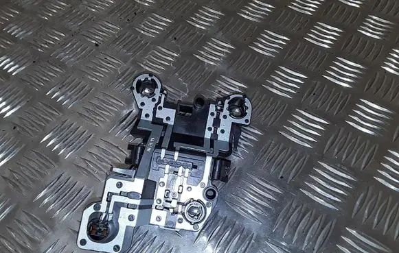 Tail light bulb cover holder