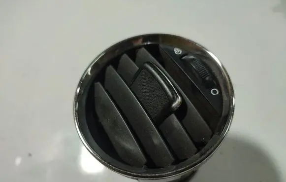 Dash center air vent grill